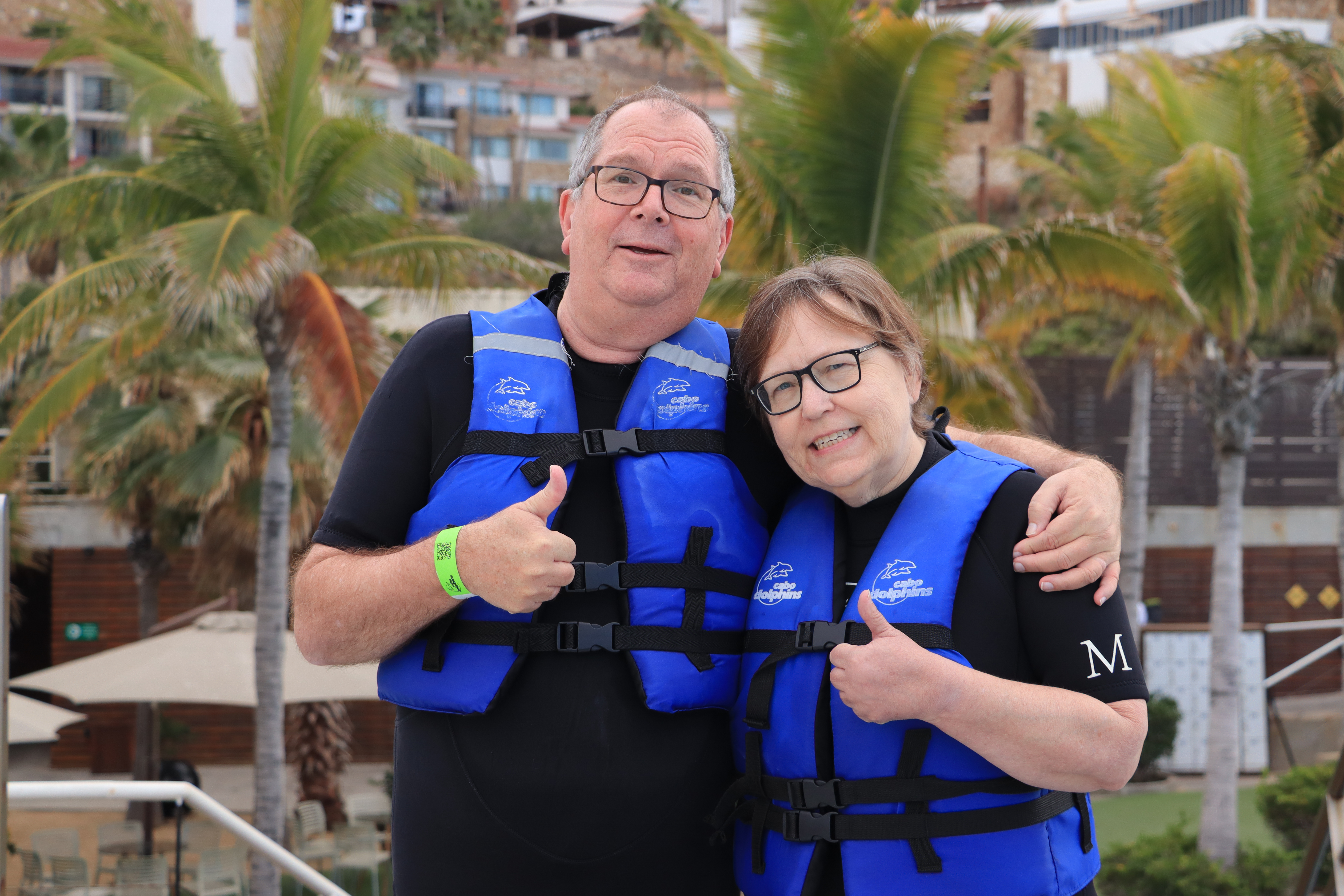 David and Sherrill swimming with dolphins in Cabo San Lucas